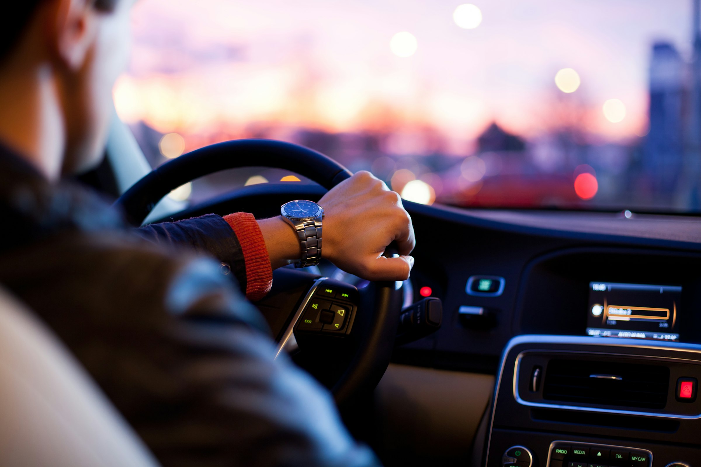 A driver enjoying the trip in a new car